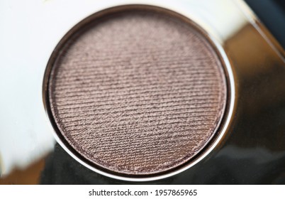 A Close-up Of Pearlescent Shimmery Gold Eyeshadow For Creating Eye Makeup.  Beauty Concept.