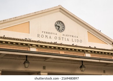 Closeup of the pediment at the entrance of the Roma - Ostia Lido station. The train connects the Italian capital to the sea.