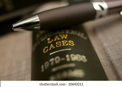 closeup of a pen on top of a law book