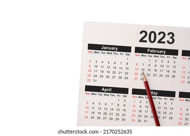 Close-Up Of Pencil On Calendar 2023. Close Up Of Pencil On Calendar On White Using As Writing Agenda Or Important Memo And Appointment And Planning On Calendar. Pencil On The Page Of A Calendar 2023