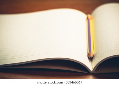 Closeup pencil on opened notebook