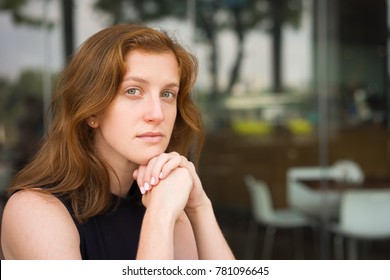 Closeup of Pensive Female Manager at Office Cafe - Powered by Shutterstock