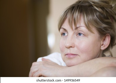 Closeup of a pensive middle aged woman - Powered by Shutterstock