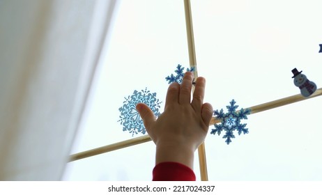 close-up, people decorate the window in the house with Christmas decorations, stickers. High quality photo - Powered by Shutterstock