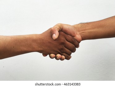 Closeup Of People Shaking Hands On The White Background.