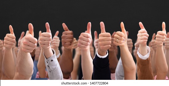 Close-up Of People's Hand Showing Thumb Up Sign Over Black Backdrop - Shutterstock ID 1407722804