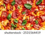 Close-up pepperoni pizza with basil. Pizza textured background. Use for menu and banner. High quality photo