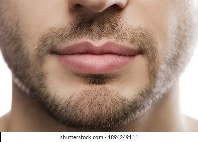 Close-up of perfect male plump lips after filler injection