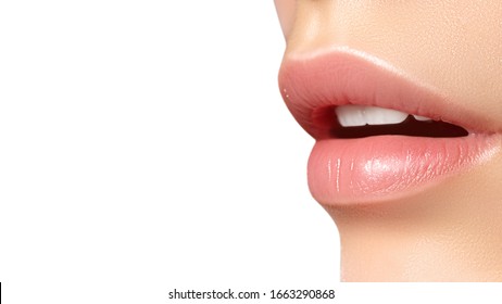 Close-up perfect natural lip makeup beautiful female mouth. Plump sexy full lips. Macro photo face detail. Perfect clean skin, fresh lip make-up. Beautiful spa tender lips