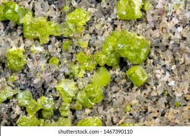 Closeup Of A Peridot Or Olivin Mineral Stone Pattern Background, Details And Macro Of Mineralogy 