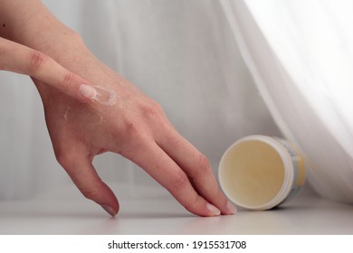 Closeup Of A Person Applying Vaseline (petroleum Jelly).