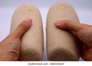 Close-up Of A Person Holding A Shoe Keeper