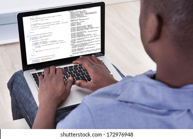 Close-up Of Person Typing On Laptop At Home - Powered by Shutterstock