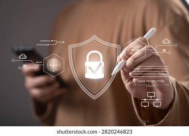 Close-up of a person using a digital interface with cybersecurity and data protection icons. Concept of network security, privacy, secure access, cloud protection, encryption, and information security