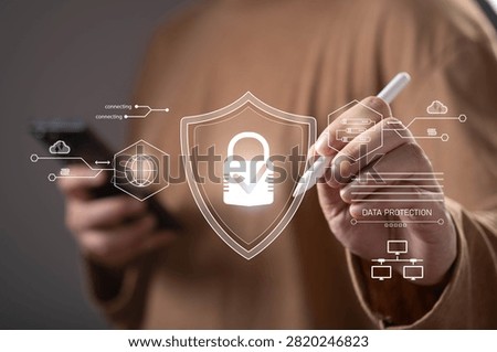 Close-up of a person using a digital interface with cybersecurity and data protection icons. Concept of network security, privacy, secure access, cloud protection, encryption, and information security