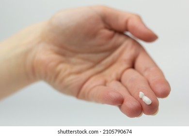 Closeup Of A Person Using Topical Treatment With Azelaic Acid For Acne And Hyperpigmentation.