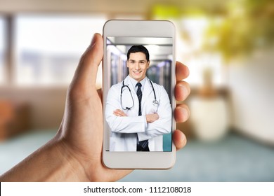 Close-up Of A Person Video Conferencing With Doctor