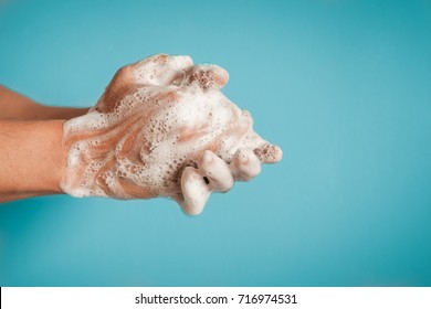 Closeup of person washing hands isolated. Cleanliness and body care concept.   - Shutterstock ID 716974531