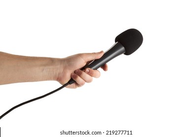 Close-up of a person's hand holding microphone on white background