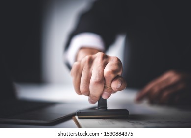 Close-up Of A Person's Hand Stamping With Approved Stamp On Text Approved Document At Desk,  Contract Form Paper - Shutterstock ID 1530884375