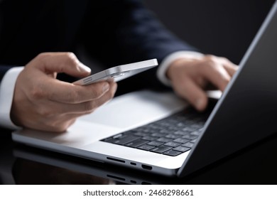 Close-up of a person's hand using a mobile phone for online shopping.
