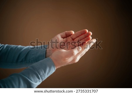 Close-up of person's hands praying. Concept of faith, Ramadan, and spirituality