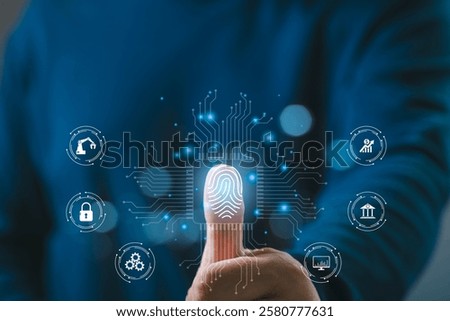 Close-up of a person's thumb using digital fingerprint scanning technology, surrounded by futuristic virtual icons on a dark background.