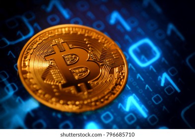 closeup of phisical bitcoin over binary background.
