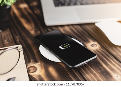 close-up phone charging on wireless charger device