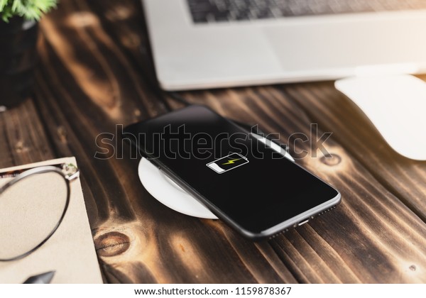 close-up phone
charging on wireless charger
device