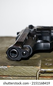 Close-up Photo Of A 9mm Pistol, From The Side Of The Gun Barrel.