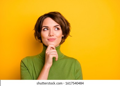 Closeup photo amazing short hairdo lady looking up empty space deep thinking creative person arm chin wear casual green turtleneck isolated yellow color background
