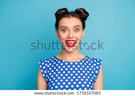 Closeup photo of attractive pretty lady beaming smiling red lipstick open mouth listen amazing good news wear dotted white blouse shirt isolated blue color background