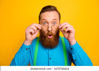 Closeup Photo Of Attractive Red Head Guy Taking Off Specs Excited Good Eyesight After Correction Operation Wear Bright Blue Shirt Green Suspenders Isolated Yellow Color Background