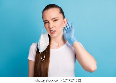 Closeup Photo Of Beautiful Displeased Lady Bad Mood Hate Use Facial Respirators Sensitive Skin Touch Ear Ache Wear Latex Gloves Protect Face Mask White T-shirt Isolated Blue Color Background