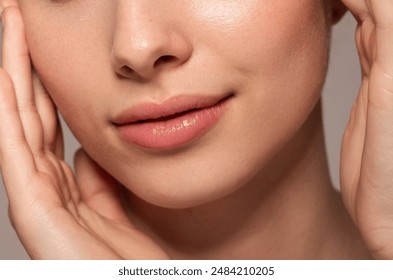 Close-up photo of a beautiful young woman's face with fresh and smooth skin and pink lips with a light background _ smooth skin with skin and body care  - Powered by Shutterstock