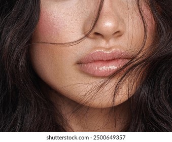 Close-up photo of a beautiful young woman's face with fresh and smooth skin and pink lips with a light background _ smooth skin with skin and body care  - Powered by Shutterstock