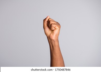 Closeup Photo Of Black Skin Arm Crowd Leader People Protesting Uprising Strike Activist Raise Fist Equal Human Rights Revolution Democracy Against Gun Violence Isolated Grey Color Background