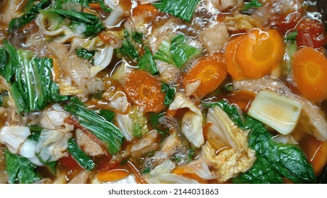 Closeup Photo Of Capcay Or Cap Cai Being Cooked In A Wok Pan. Indonesian Chinese Food. Made From Various Kinds Of Vegetables Such As Carrots, Mustard Greens, Chinese Cabbage, Tomatoes, And Cabbage.