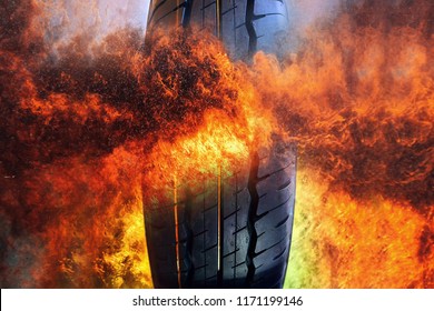 Close-up Photo Of Car Tire On Frame Of Fire  Background . Rubber Product .