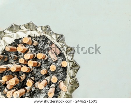 Close-up photo of cigarette ashtray background