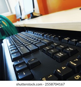 Close-up photo of a computer keyboard featuring sleek design and detailed keycaps. Ideal for technology concepts, workspace designs, or modern digital backgrounds.