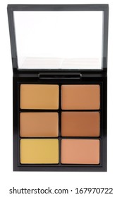 Closeup photo of a concealer and corrector palette with different medium skin tone shade to conceal under-eye circles or facial blemishes, isolated on white background