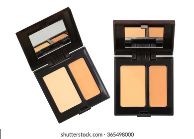 Closeup photo of a concealer palettes in different shades to conceal under-eye circles or facial blemishes, isolated on white