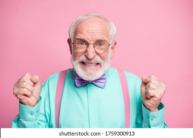 Closeup Photo Of Crazy Grandpa Negative Facial Expression Grimace Outraged Raise Fists Grinning Wear Specs Mint Shirt Suspenders Violet Bow Tie Isolated Pink Pastel Color Background