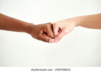 close-up photo of diverse hands, friendship and respect, racism concept. female hands with different skin colour opposite each other