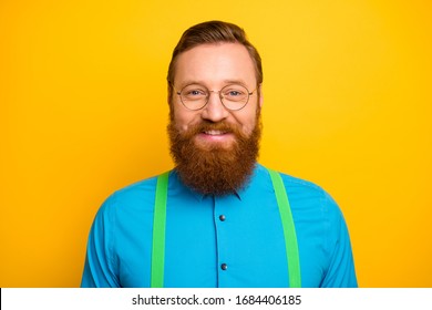 Closeup Photo Of Excited Funny Red Head Guy Toothy Beaming Smiling Elegant Look Wear Specs Bright Blue Shirt Green Suspenders Isolated Yellow Color Background