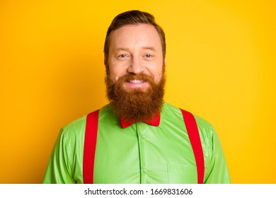 Closeup Photo Of Excited Happy Red Head Guy Toothy Beaming Smiling Elegant Look Wear Bright Green Shirt Red Suspenders Bow Tie Isolated Vivid Color Background