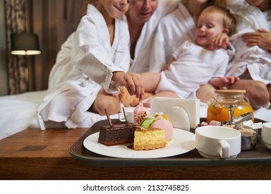 Close-up Photo Of Family Having Breakfast In The Hotel