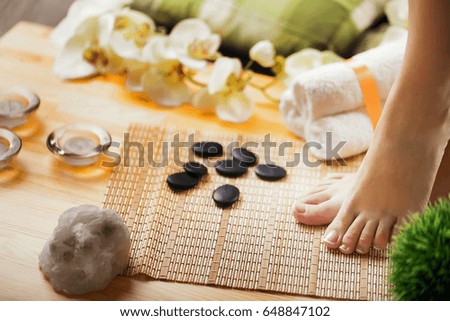 Closeup photo of a female feet at spa salon